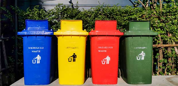 Demonstrating examples of different waste containers that prevent cross-contamination